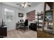 Home office features a desk, chair, and built-in shelving at 17244 W Lynx Rd, Goodyear, AZ 85338