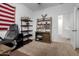 Home office with desk, chair, and bookshelves at 17244 W Lynx Rd, Goodyear, AZ 85338
