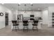 Modern kitchen with white cabinets, granite countertops, and an island at 17244 W Lynx Rd, Goodyear, AZ 85338