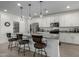 Spacious kitchen with island, white cabinets, and modern appliances at 17244 W Lynx Rd, Goodyear, AZ 85338