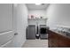 Laundry room with washer, dryer, and folding area at 17244 W Lynx Rd, Goodyear, AZ 85338