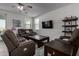 Relaxing living room with comfortable seating and a large TV at 17244 W Lynx Rd, Goodyear, AZ 85338