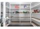 Well-organized pantry with ample shelving for storage at 17244 W Lynx Rd, Goodyear, AZ 85338
