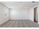 Bright bedroom featuring neutral walls and carpet at 17631 W Sanna St, Waddell, AZ 85355