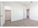 Spacious bedroom featuring carpet and two walk-in closets at 17631 W Sanna St, Waddell, AZ 85355