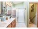 Main bathroom with double vanity and large walk-in shower at 18064 W Buena Vista Dr, Surprise, AZ 85374