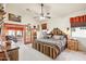 King-size bed, access to sunroom, and ensuite bathroom at 18064 W Buena Vista Dr, Surprise, AZ 85374