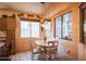 Bright dining area with a round table and chairs at 18064 W Buena Vista Dr, Surprise, AZ 85374