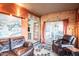 Rustic Gathering room with leather furniture and access to patio at 18064 W Buena Vista Dr, Surprise, AZ 85374