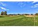 Scenic view of a lush green golf course with mountains in the background at 18064 W Buena Vista Dr, Surprise, AZ 85374