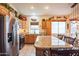 Kitchen boasts granite countertops and wood cabinets at 18064 W Buena Vista Dr, Surprise, AZ 85374