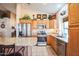 Kitchen with island, stainless steel appliances, and wood cabinets at 18064 W Buena Vista Dr, Surprise, AZ 85374