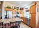 Kitchen with stainless steel appliances and wood cabinets at 18064 W Buena Vista Dr, Surprise, AZ 85374