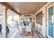 Covered patio with seating area and outdoor dining table at 18064 W Buena Vista Dr, Surprise, AZ 85374