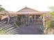 Spacious backyard patio with seating, bar, and fire pit at 18064 W Buena Vista Dr, Surprise, AZ 85374