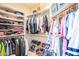 Large walk-in closet with ample shelving and hanging space at 18064 W Buena Vista Dr, Surprise, AZ 85374