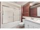 Bathroom with tub, shower, and white vanity at 18202 N 99Th Dr, Sun City, AZ 85373