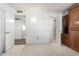 Simple bedroom with wood furniture and closets at 18202 N 99Th Dr, Sun City, AZ 85373