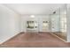 Bright dining room with French doors leading to the patio at 18202 N 99Th Dr, Sun City, AZ 85373