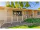 Brick ranch house with decorative railing and mature landscaping at 18202 N 99Th Dr, Sun City, AZ 85373