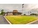 Golf clubhouse with large windows and flagpoles at 18202 N 99Th Dr, Sun City, AZ 85373