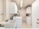 Laundry room with cabinets, sink, and washer/dryer at 18202 N 99Th Dr, Sun City, AZ 85373