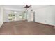 Living room with glass partition and access to backyard at 18202 N 99Th Dr, Sun City, AZ 85373