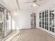 Sunroom with tile floors and glass doors leading to patio at 18202 N 99Th Dr, Sun City, AZ 85373