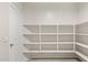 Bright and spacious pantry with multiple shelves at 18366 W Desert Hollow Dr, Wittmann, AZ 85361