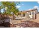 Landscaped backyard with covered patio and walkway at 19241 N Emerald Cove Way, Surprise, AZ 85387
