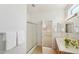Clean bathroom with shower, double vanity, and access to bedroom at 19241 N Emerald Cove Way, Surprise, AZ 85387