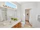 Bathroom boasts a vanity, shower, and linen closet at 19241 N Emerald Cove Way, Surprise, AZ 85387