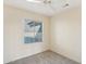 Spacious bedroom with ceiling fan and window coverings at 19241 N Emerald Cove Way, Surprise, AZ 85387