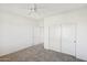 Bedroom with double door closet and access to bathroom at 19241 N Emerald Cove Way, Surprise, AZ 85387