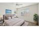 Relaxing bedroom with a plush bed, neutral color palette, and ample natural light at 19241 N Emerald Cove Way, Surprise, AZ 85387