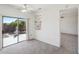 Bright dining area with built-in shelving and access to the backyard at 19241 N Emerald Cove Way, Surprise, AZ 85387