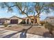 One-story home with attached garage and desert landscaping at 19241 N Emerald Cove Way, Surprise, AZ 85387