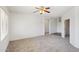 Living room with ceiling fan and access to other areas of the home at 19241 N Emerald Cove Way, Surprise, AZ 85387