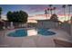 Inviting community pool with lounge chairs and umbrellas at 2213 N Recker Rd, Mesa, AZ 85215