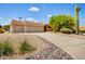 Three-car garage with driveway and desert landscaping at 25801 N Abajo Dr, Rio Verde, AZ 85263