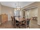 Bright dining room with hardwood floors and a wood table at 25971 W Taro Dr, Buckeye, AZ 85396