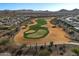 Aerial view of a beautiful golf course surrounded by a residential community at 25971 W Taro Dr, Buckeye, AZ 85396