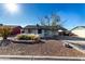 Cute single story home with landscaped front yard and spacious driveway at 261 W 21St Ave, Apache Junction, AZ 85120