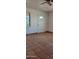 Living room with tile floors, white walls, and an exterior door at 321 S Bridge St, Superior, AZ 85173