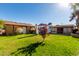 A backyard with a grassy area and storage shed at 3428 W Vogel Ave, Phoenix, AZ 85051