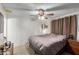 Bedroom with ceiling fan and a comfortable bed at 3428 W Vogel Ave, Phoenix, AZ 85051