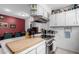 Bright kitchen features white cabinets, stainless steel appliances, and a large butcher block island at 3428 W Vogel Ave, Phoenix, AZ 85051