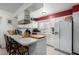 Kitchen features white cabinets and a spacious countertop at 3428 W Vogel Ave, Phoenix, AZ 85051
