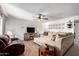 Spacious living room featuring a large sectional sofa and wood floors at 3428 W Vogel Ave, Phoenix, AZ 85051
