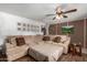 Living room with sectional sofa, wood floors, and wall art at 3428 W Vogel Ave, Phoenix, AZ 85051